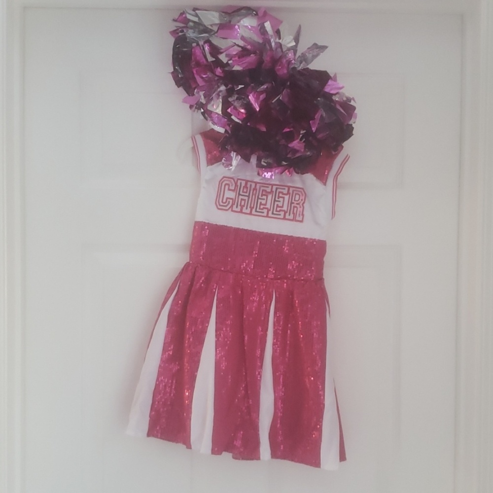 Cheerleading costume with pom poms